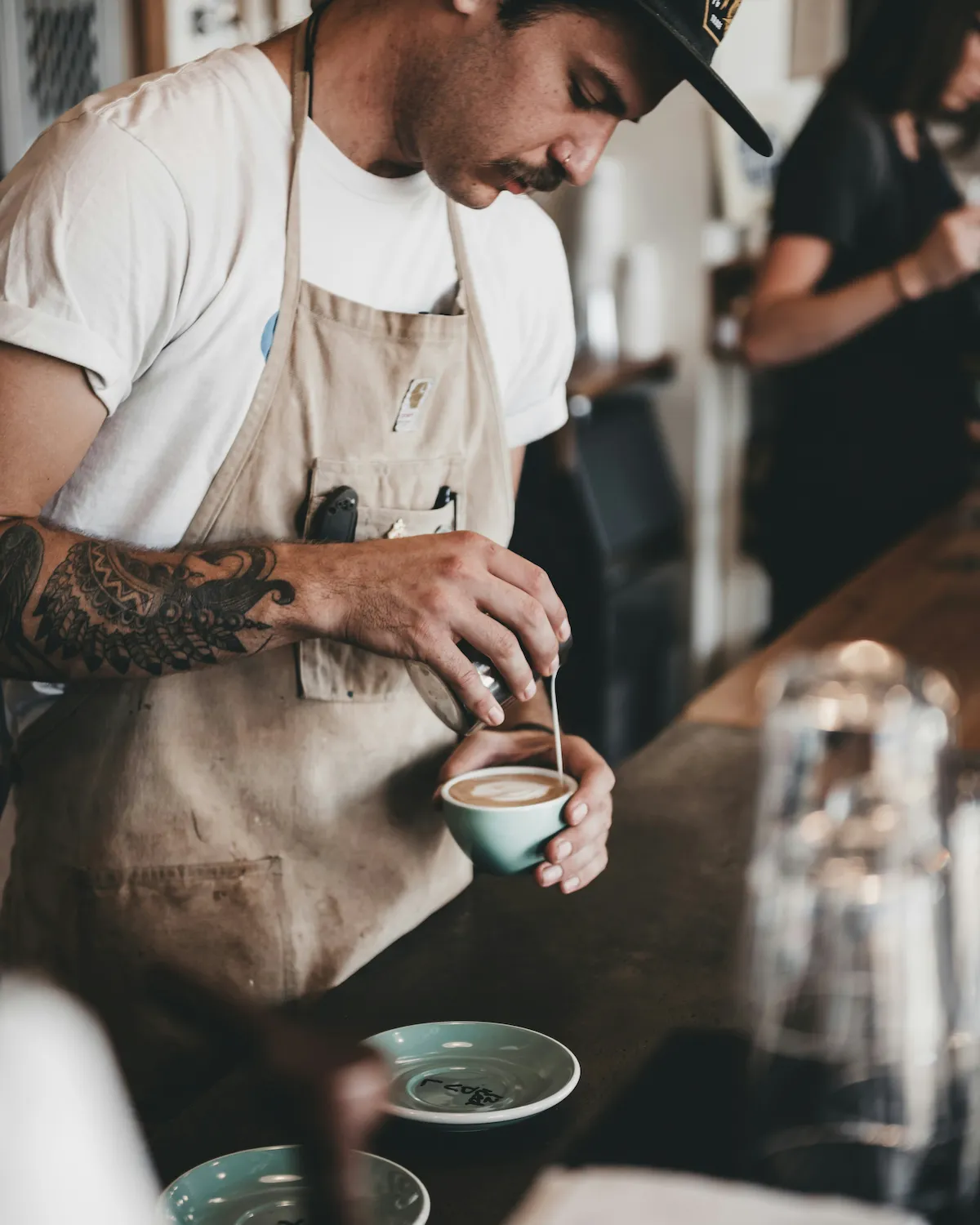 Barista preparing a handcrafted espresso drink.